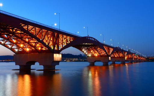 Illuminated Bridge Spanning a Tranquil River at Dusk from Chrome web store to be run with OffiDocs Chromium online Illuminated Bridge Spanning a Tranquil River at Dusk from Chrome web store to be run with OffiDocs Chromium online